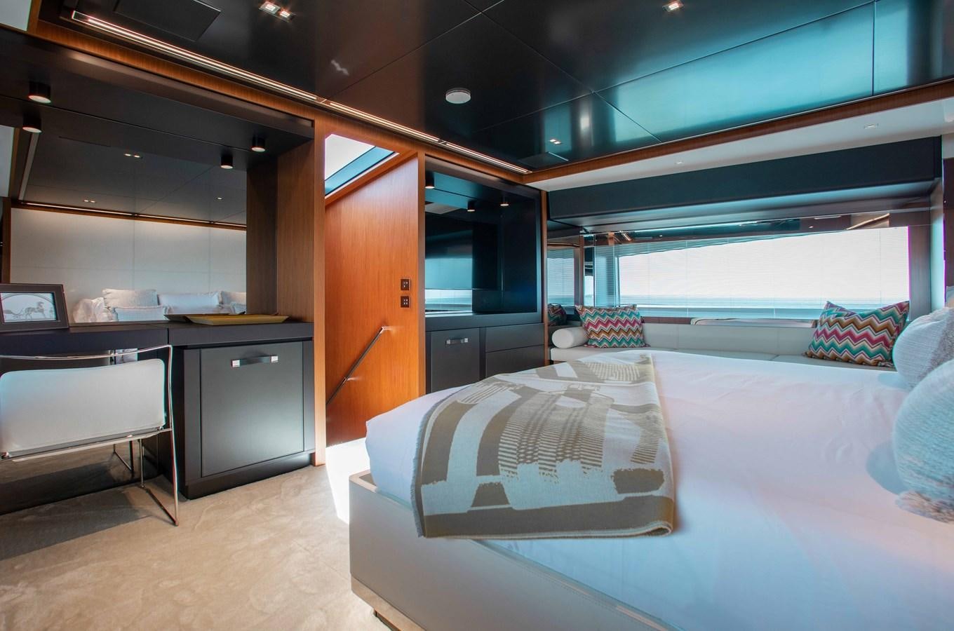 a room with a bed and desk aboard KIYOMIZU Yacht for Sale