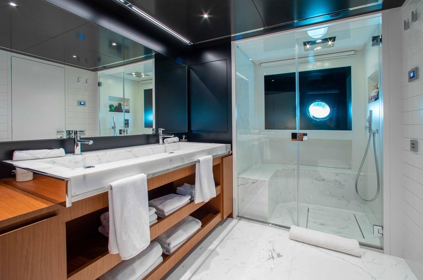 a bathroom with a large mirror aboard KIYOMIZU Yacht for Sale