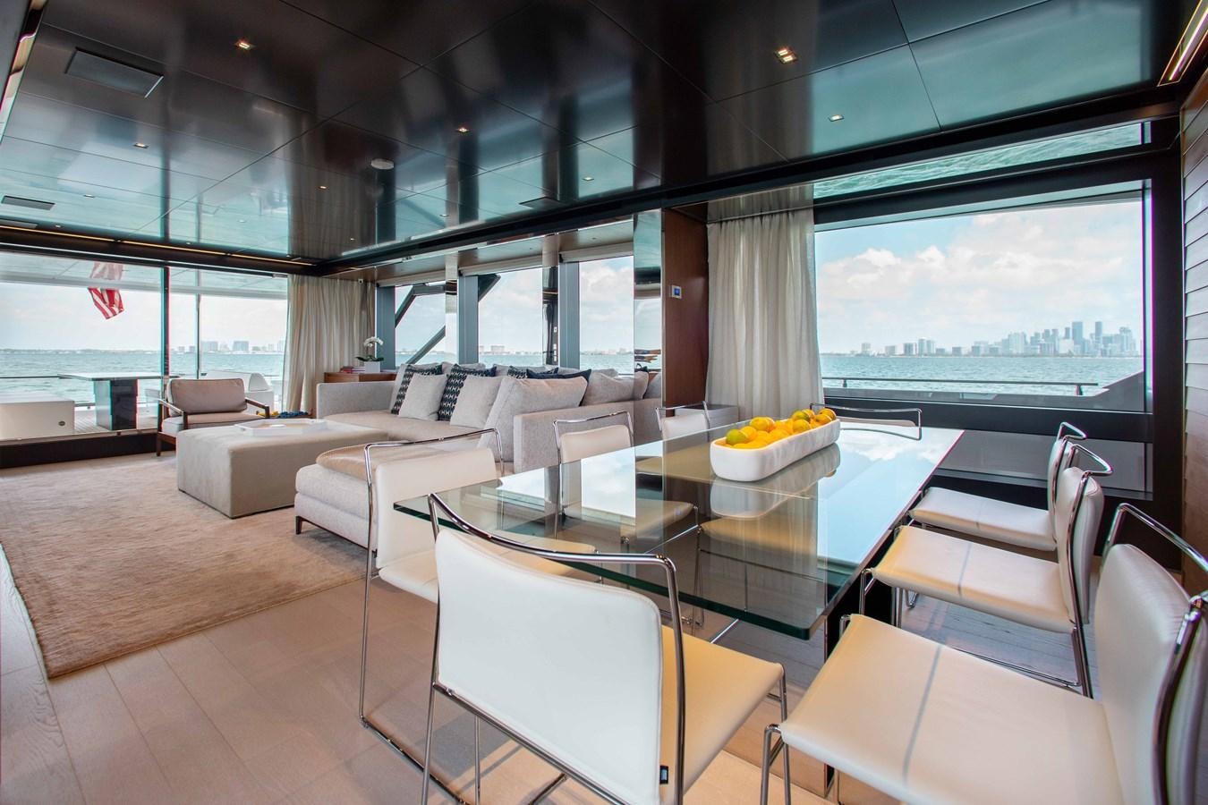 a room with a table and chairs aboard KIYOMIZU Yacht for Sale