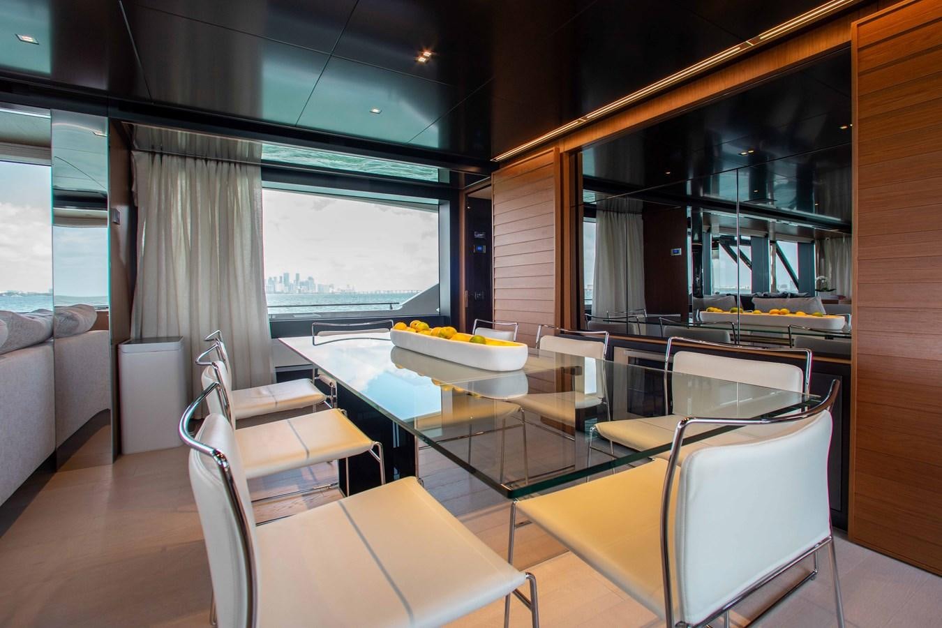 a room with a table chairs and a window aboard KIYOMIZU Yacht for Sale