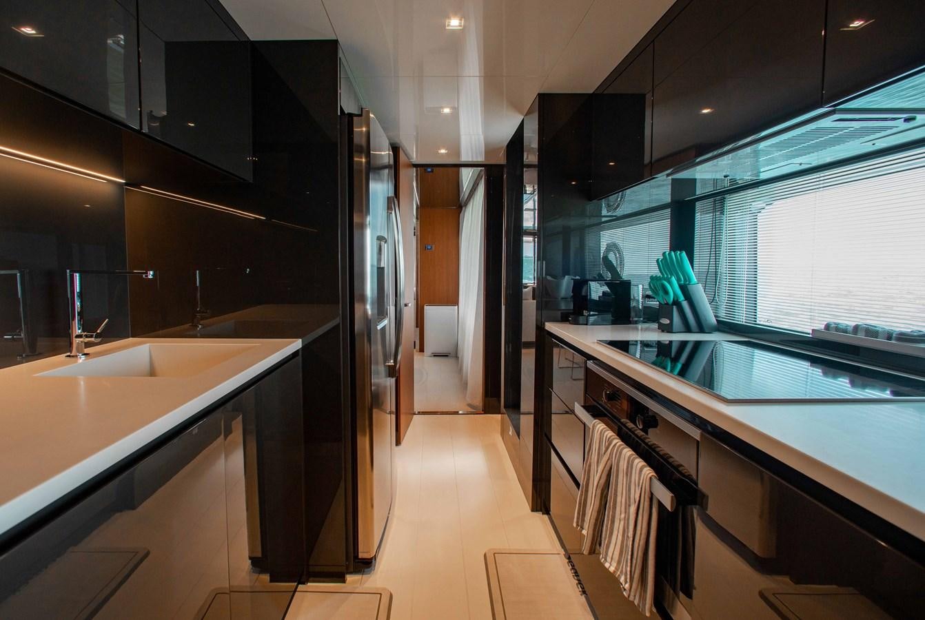 a kitchen with a large window aboard KIYOMIZU Yacht for Sale