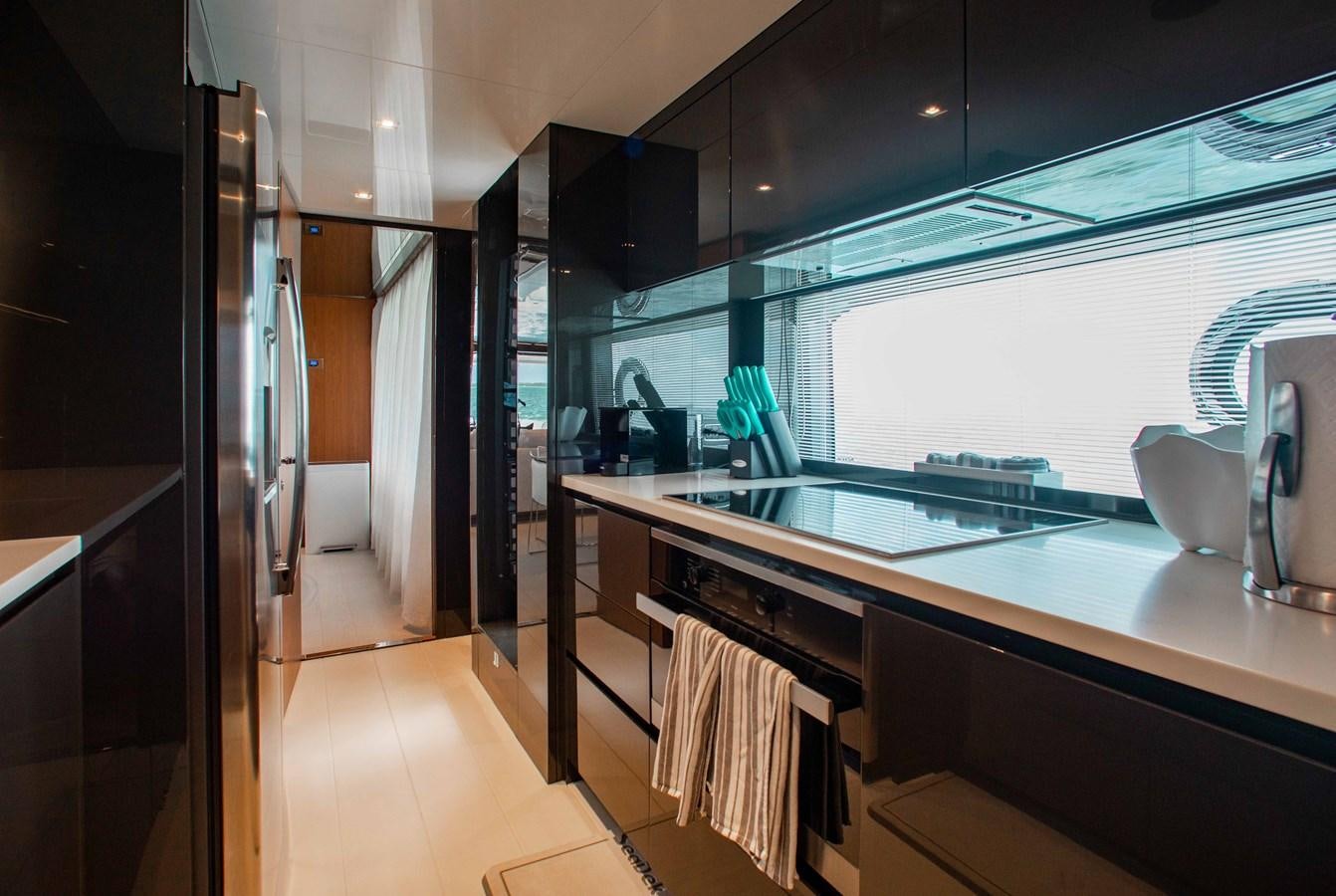 a kitchen with a large window aboard KIYOMIZU Yacht for Sale