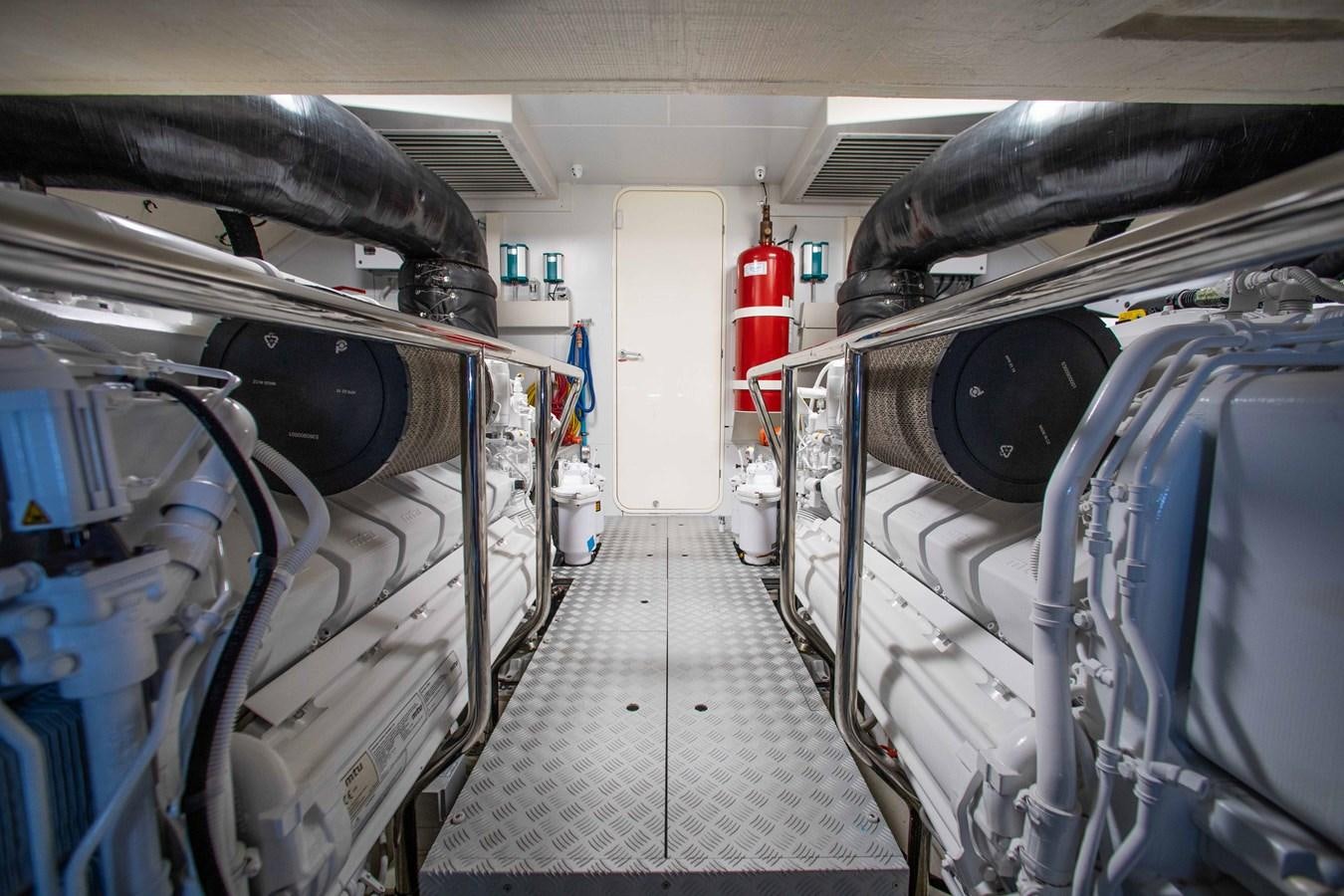 a long hallway with several rows of metal pipes aboard KIYOMIZU Yacht for Sale
