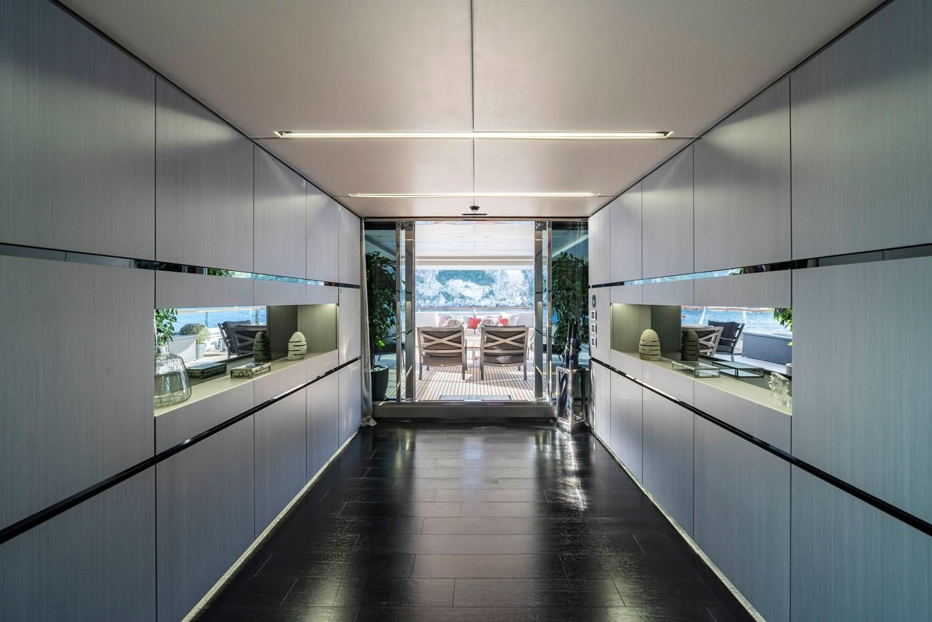 a long hallway with a wood floor aboard MAVERICK Yacht for Sale