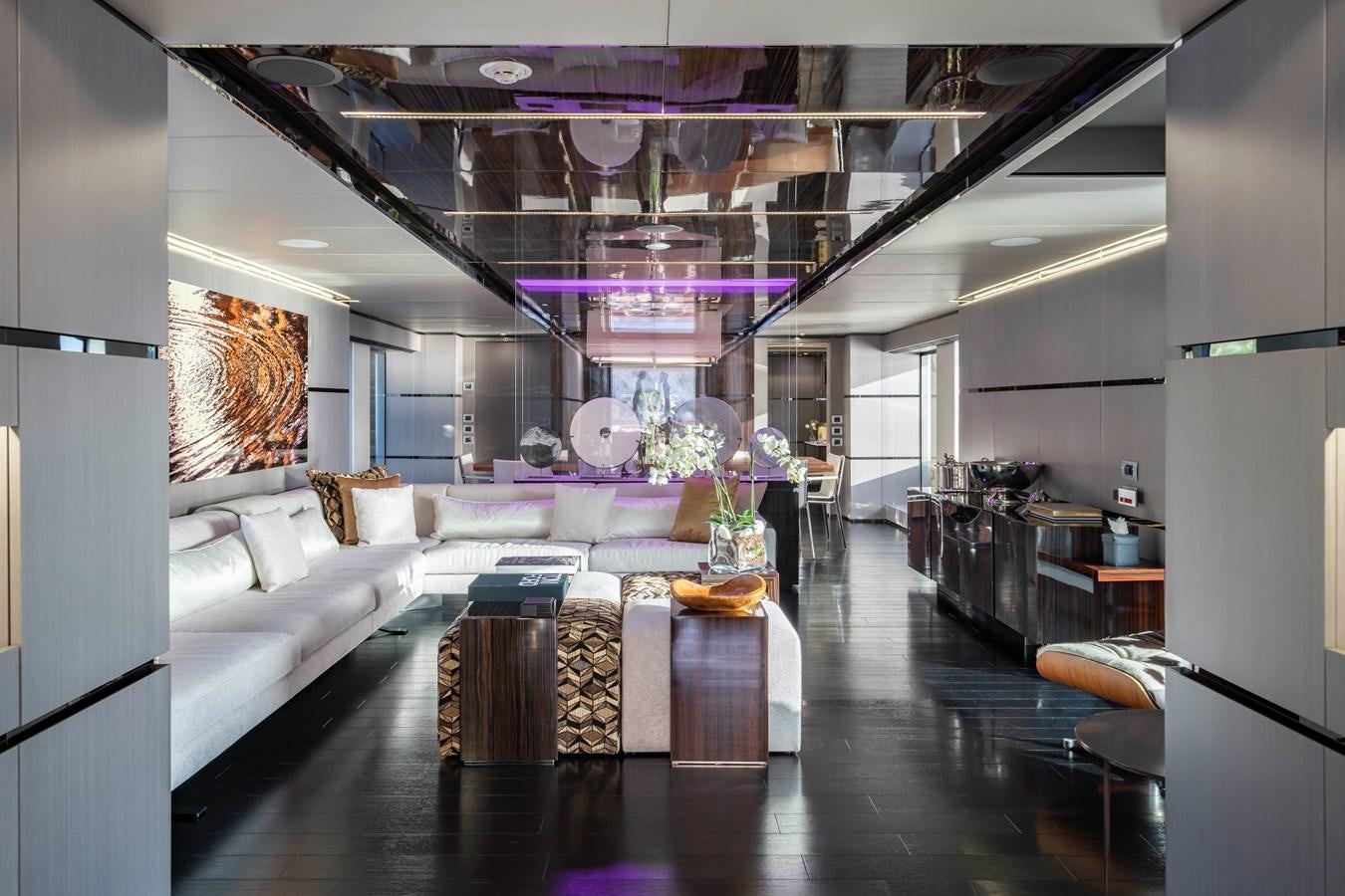 a room with a couch and a table aboard MAVERICK Yacht for Sale