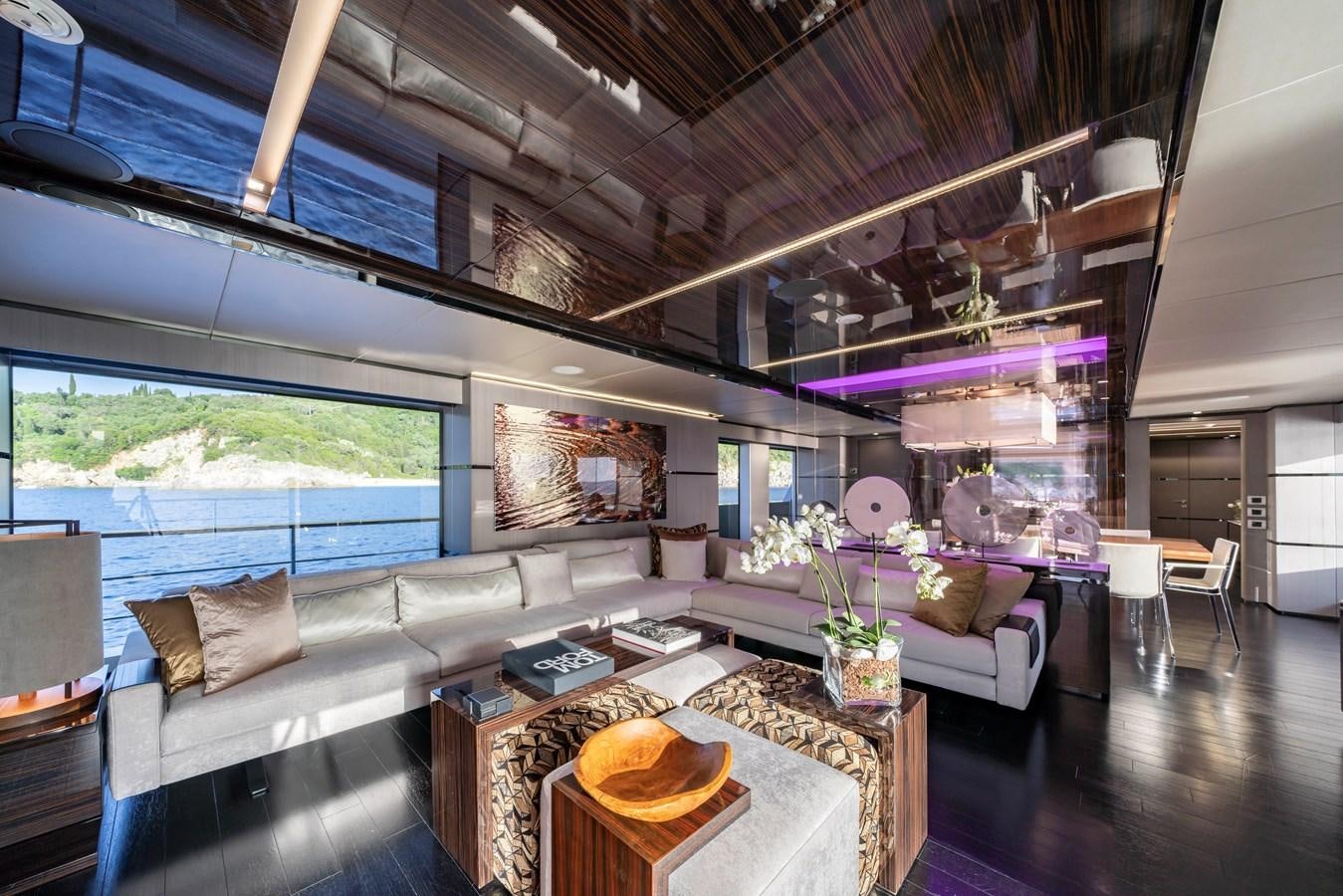 a living room with a large window aboard MAVERICK Yacht for Sale