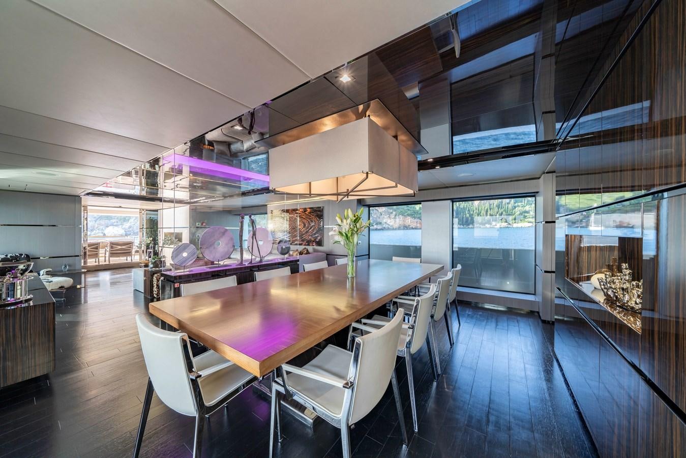 a large room with a table and chairs aboard MAVERICK Yacht for Sale