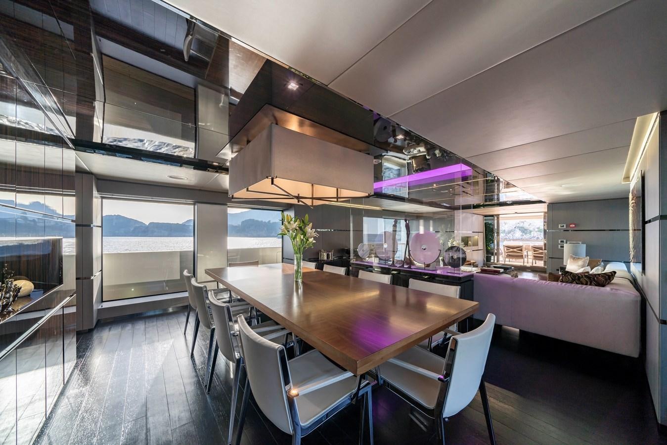 a room with a table and chairs aboard MAVERICK Yacht for Sale