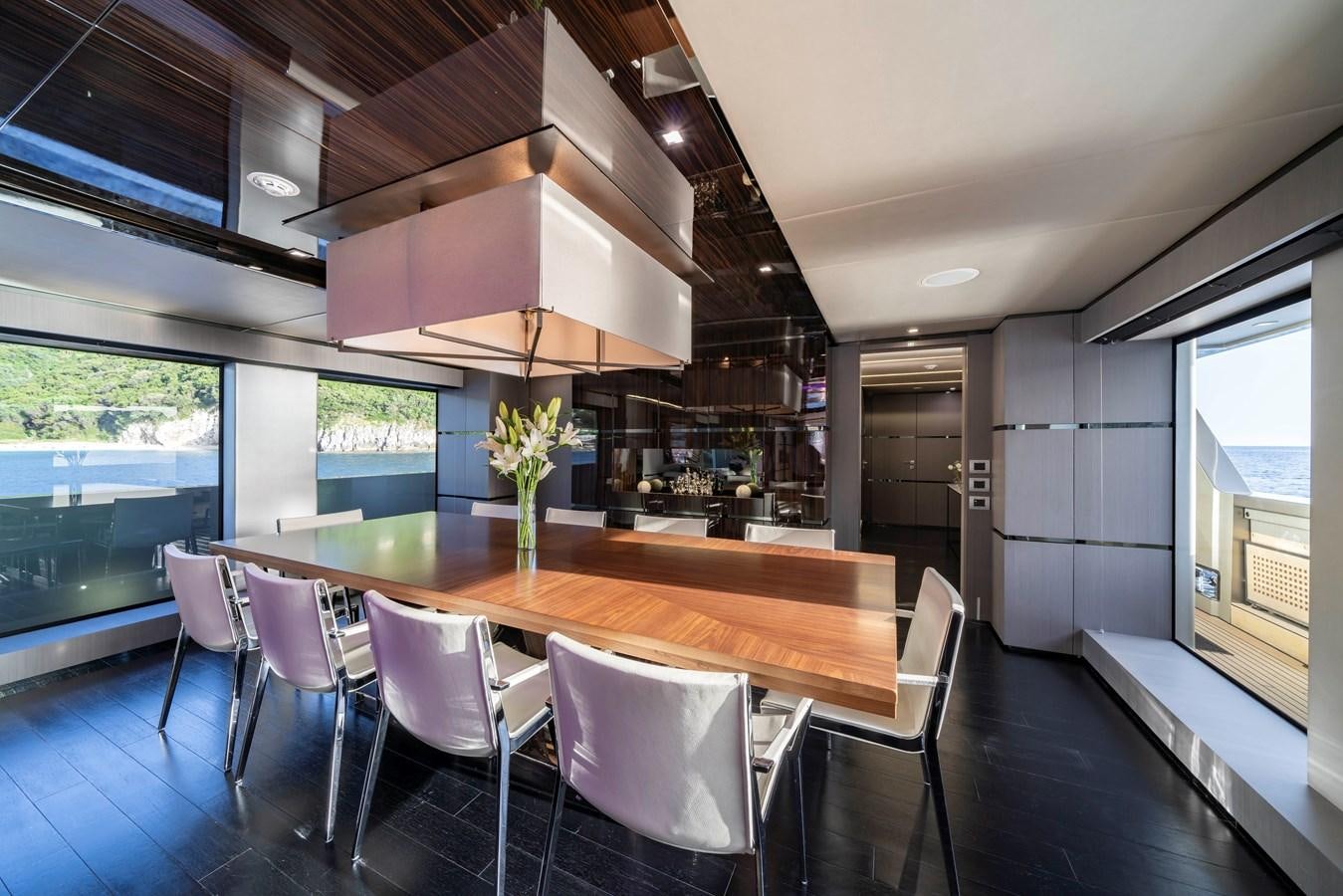 a large kitchen with a dining table aboard MAVERICK Yacht for Sale