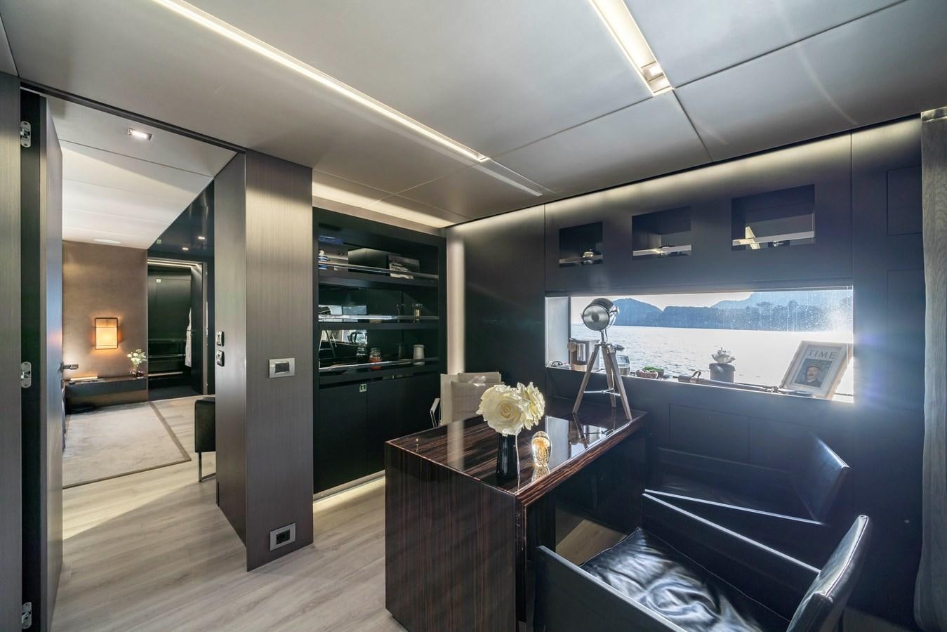 a room with a table and a tv aboard MAVERICK Yacht for Sale