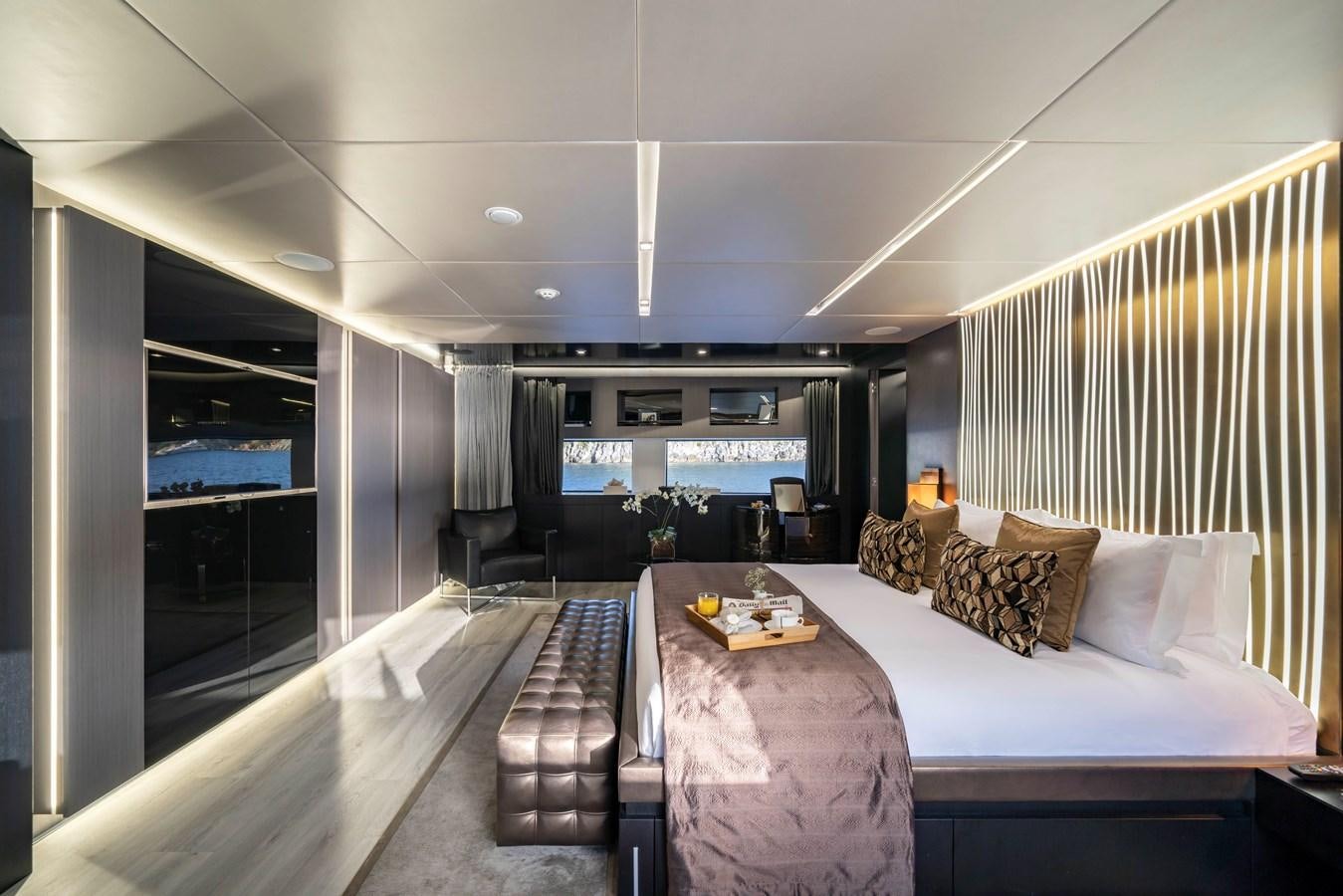 a large bedroom with a large bed aboard MAVERICK Yacht for Sale