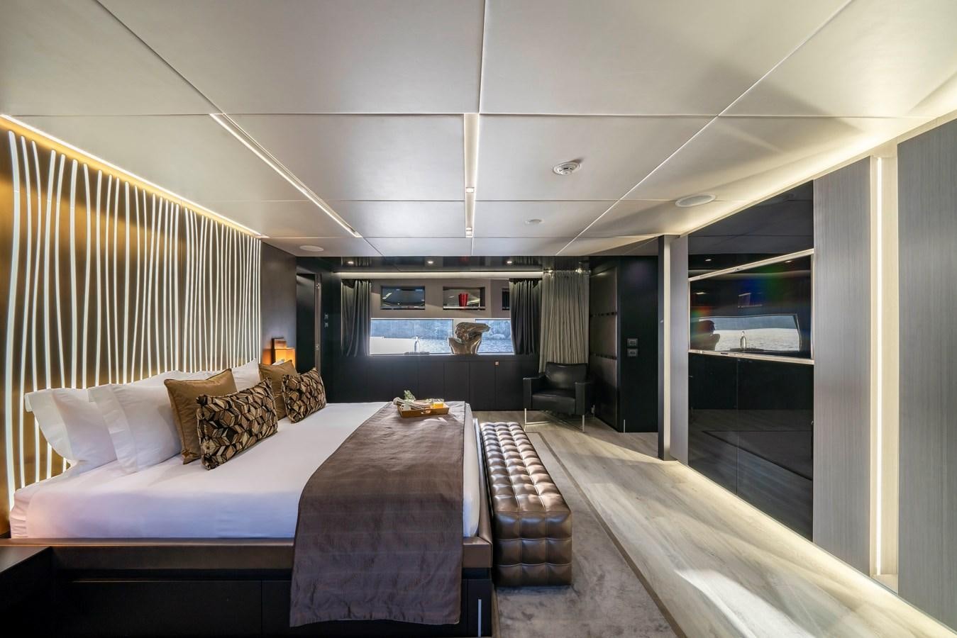 a bedroom with a bed aboard MAVERICK Yacht for Sale
