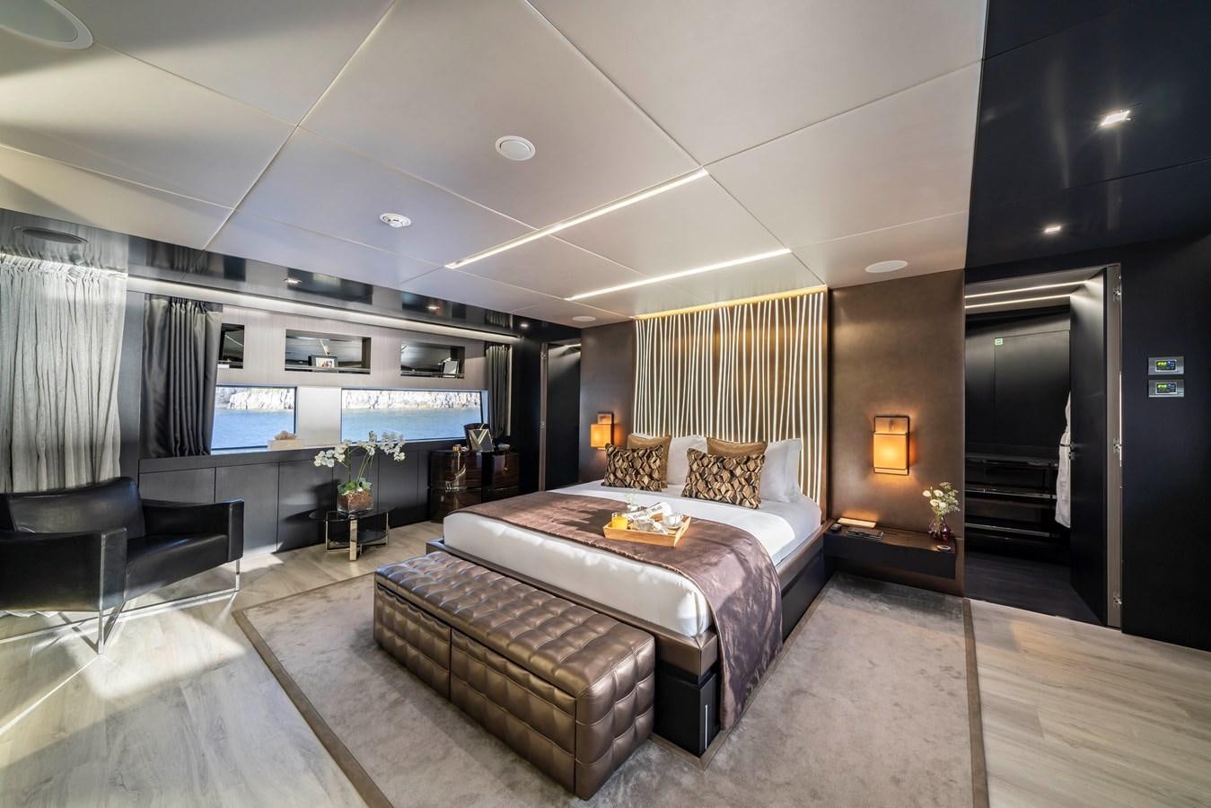 a large bedroom with a large bed aboard MAVERICK Yacht for Sale