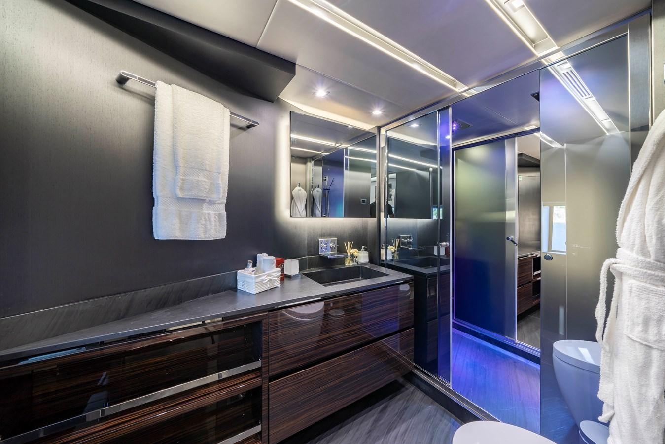 a bathroom with a countertop sink and cabinets aboard MAVERICK Yacht for Sale