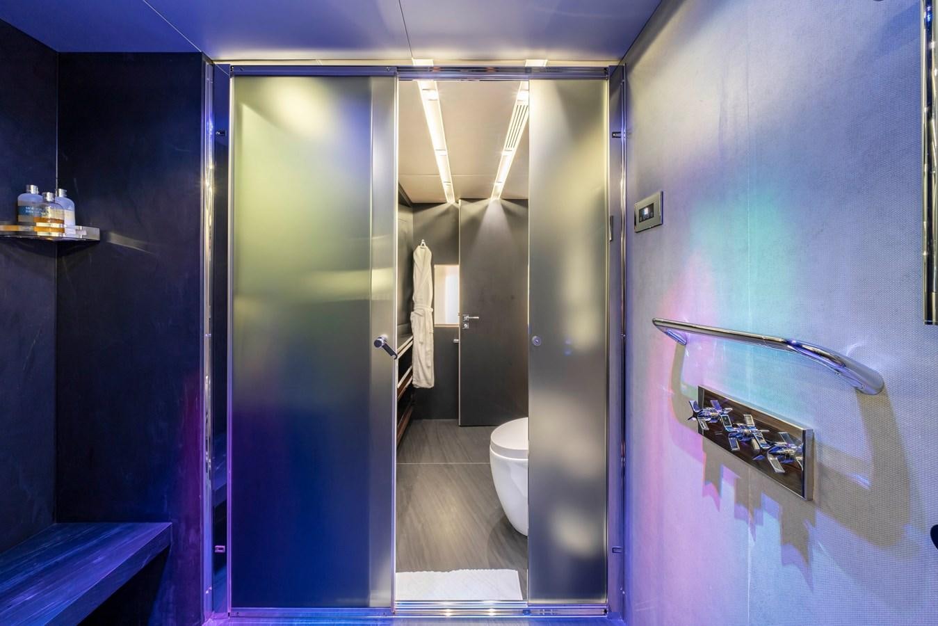 a bathroom with a glass shower aboard MAVERICK Yacht for Sale