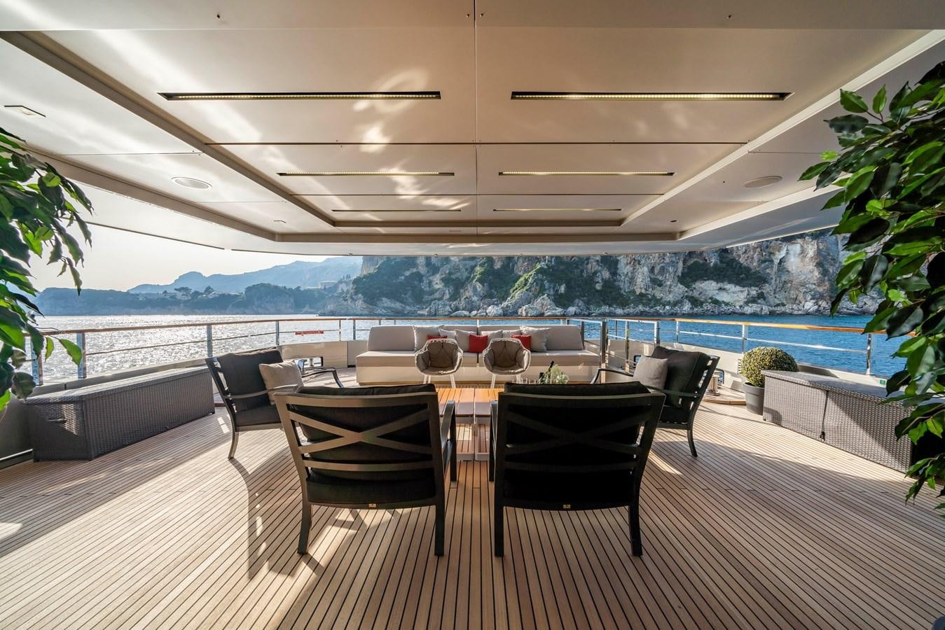 a room with a table and chairs aboard MAVERICK Yacht for Sale