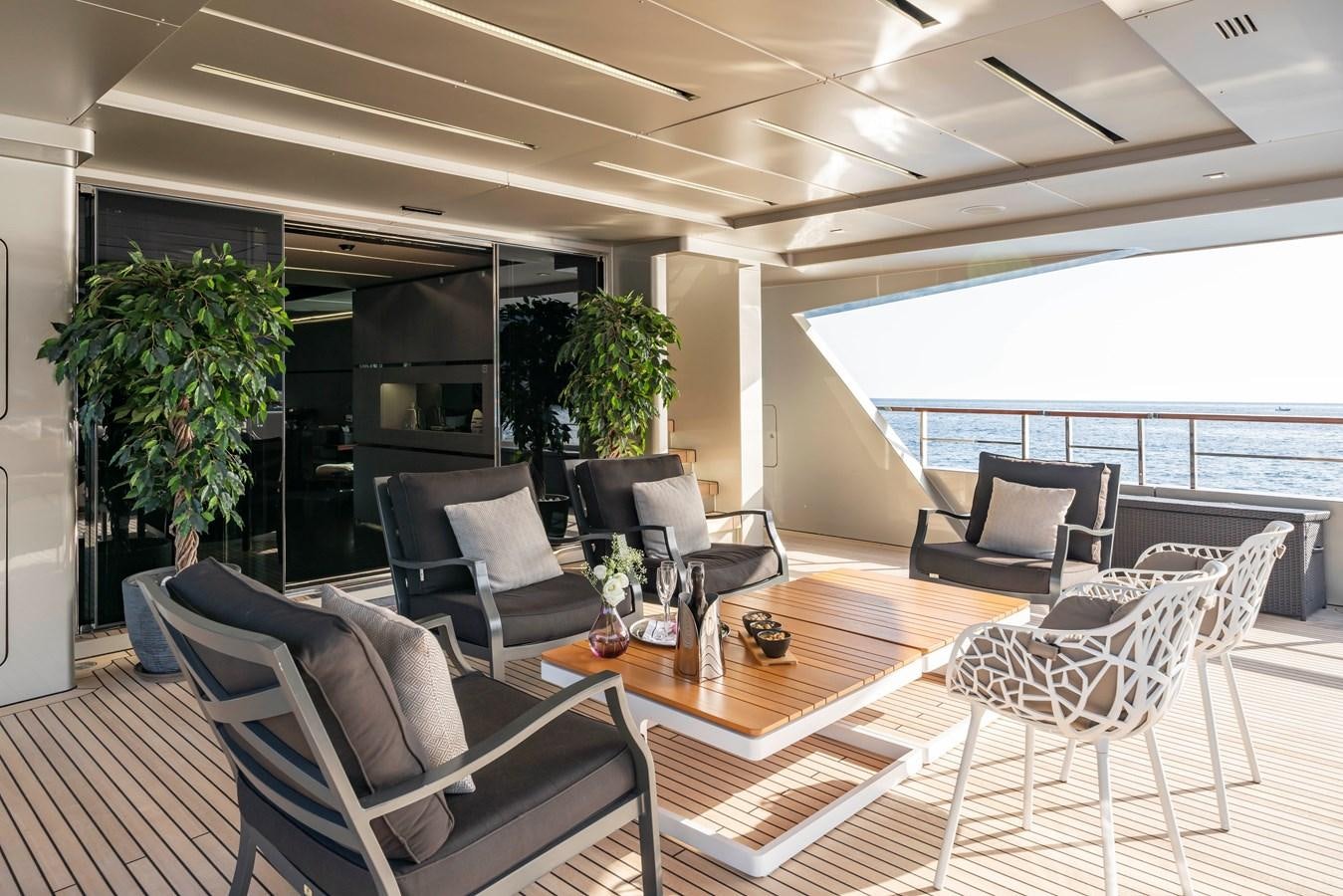 a room with chairs and a table aboard MAVERICK Yacht for Sale