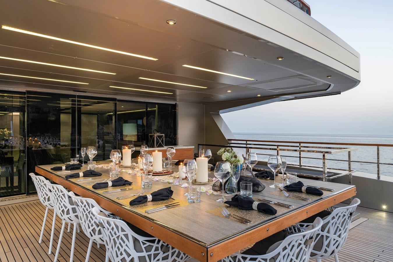 a table set for a dinner party aboard MAVERICK Yacht for Sale