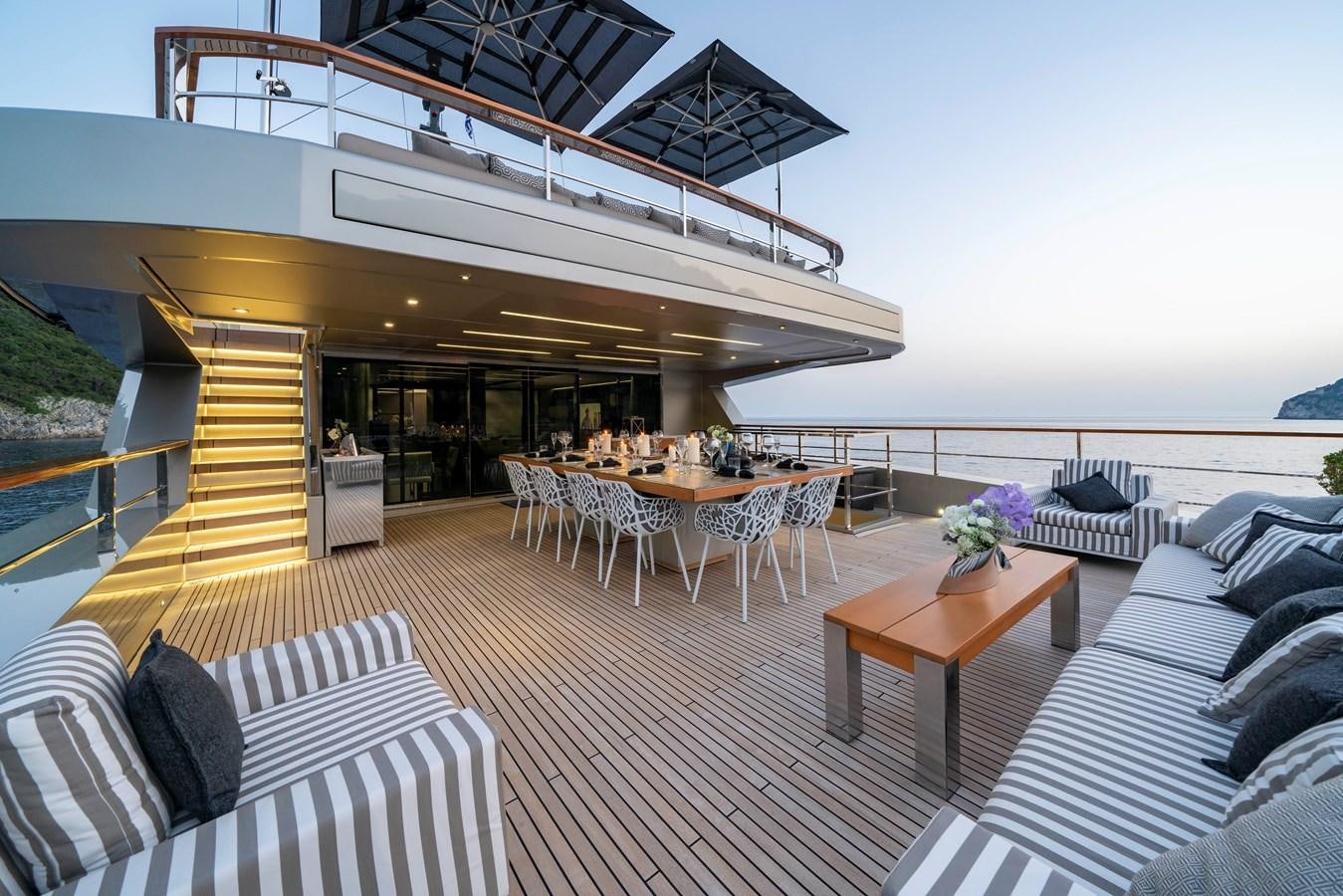 a living room with a deck and a pool aboard MAVERICK Yacht for Sale
