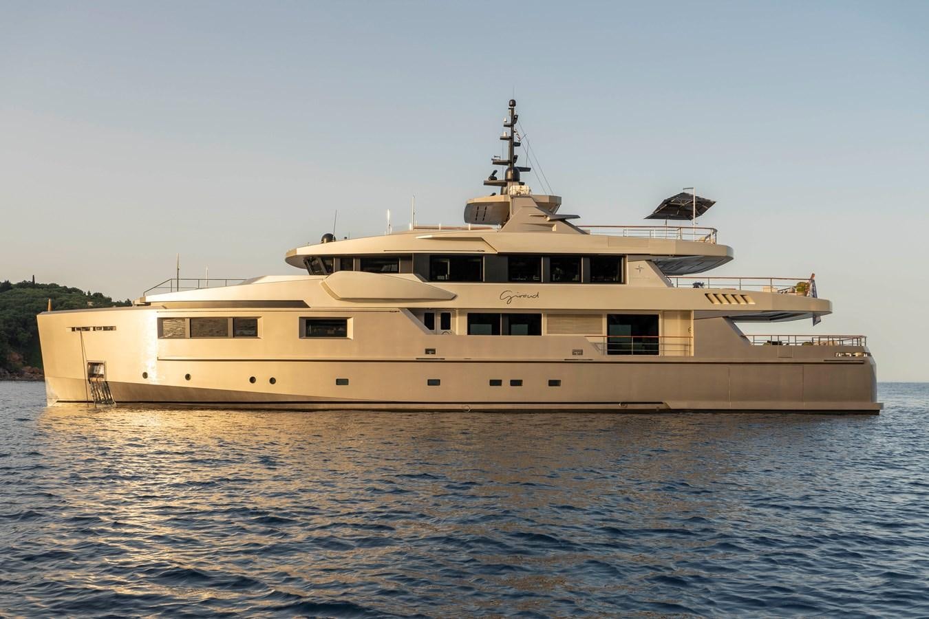 a large white boat in the water aboard MAVERICK Yacht for Sale
