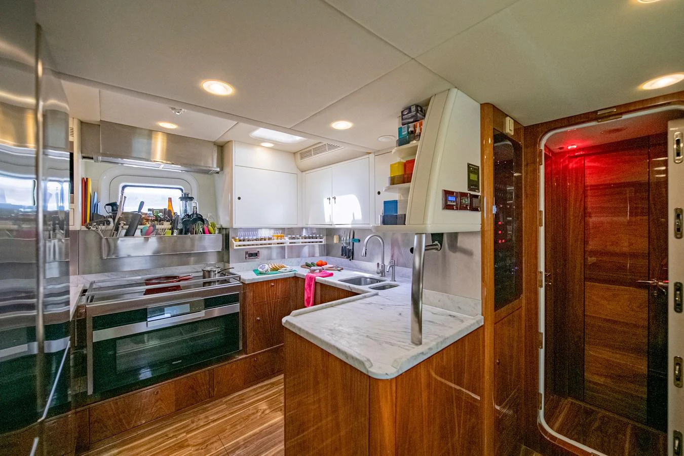 a kitchen with a glass door aboard SERAFIM Yacht for Sale