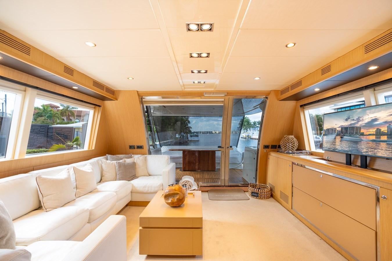 a living room with a large window aboard 75' RIVA 2012 Yacht for Sale