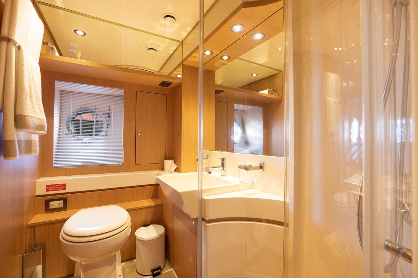 a bathroom with a sink toilet and a bathtub aboard 75' RIVA 2012 Yacht for Sale