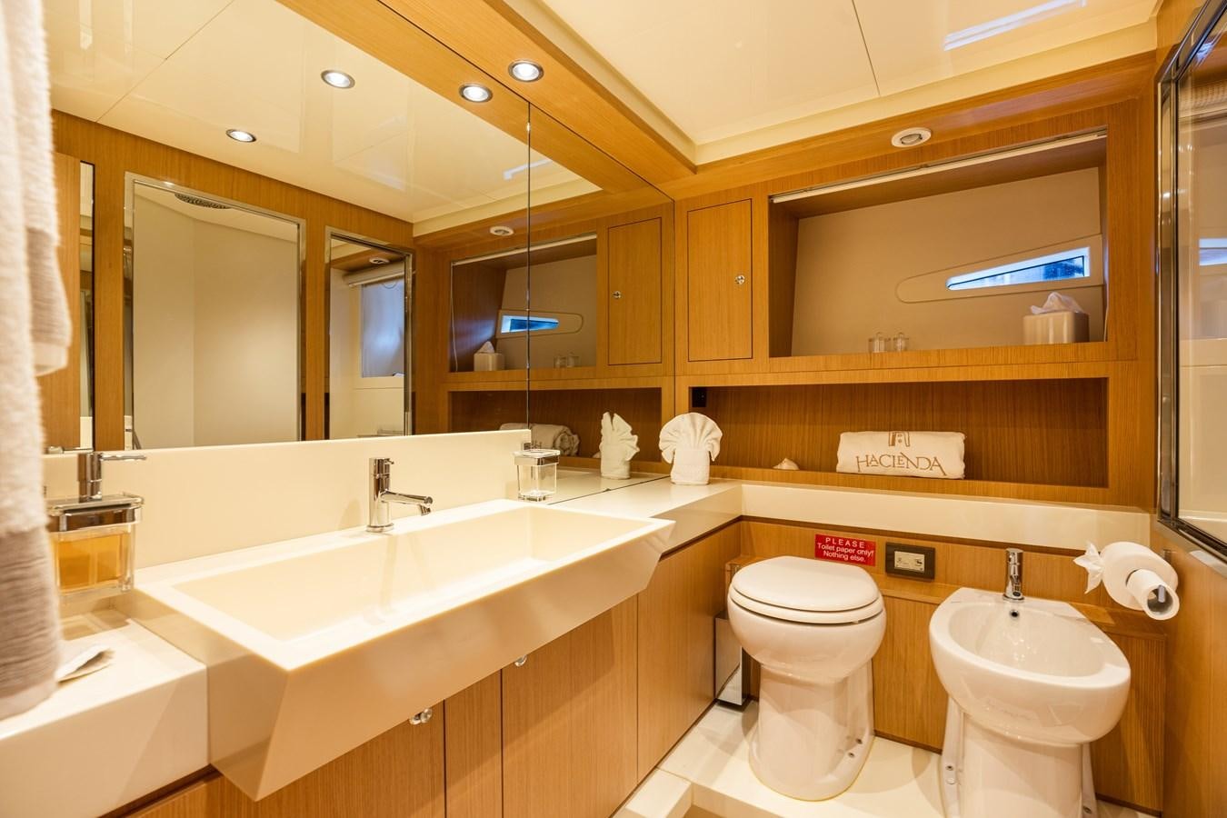a bathroom with a large mirror aboard 75' RIVA 2012 Yacht for Sale