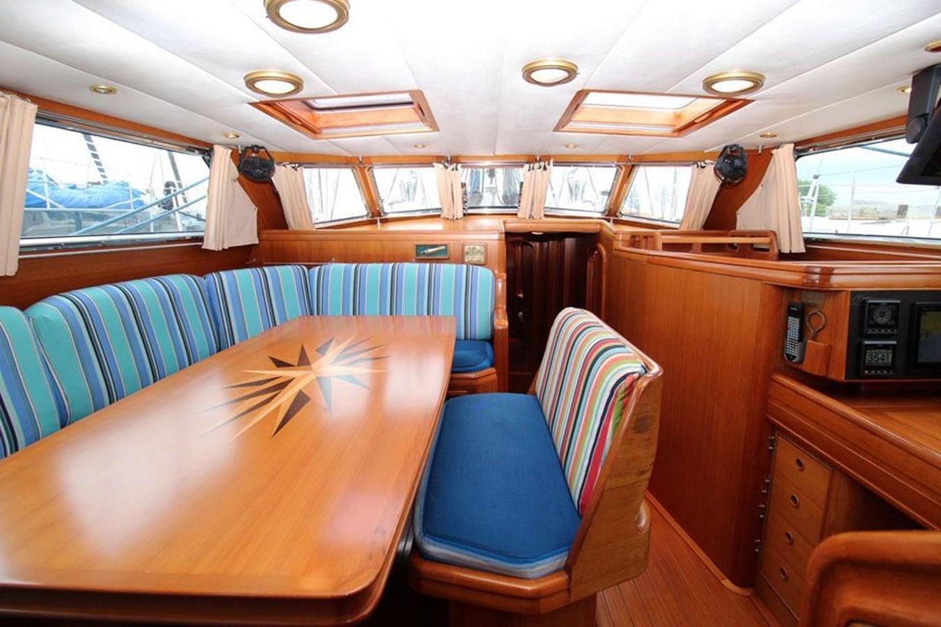 inside of a wooden cabin aboard PLUM Yacht for Sale