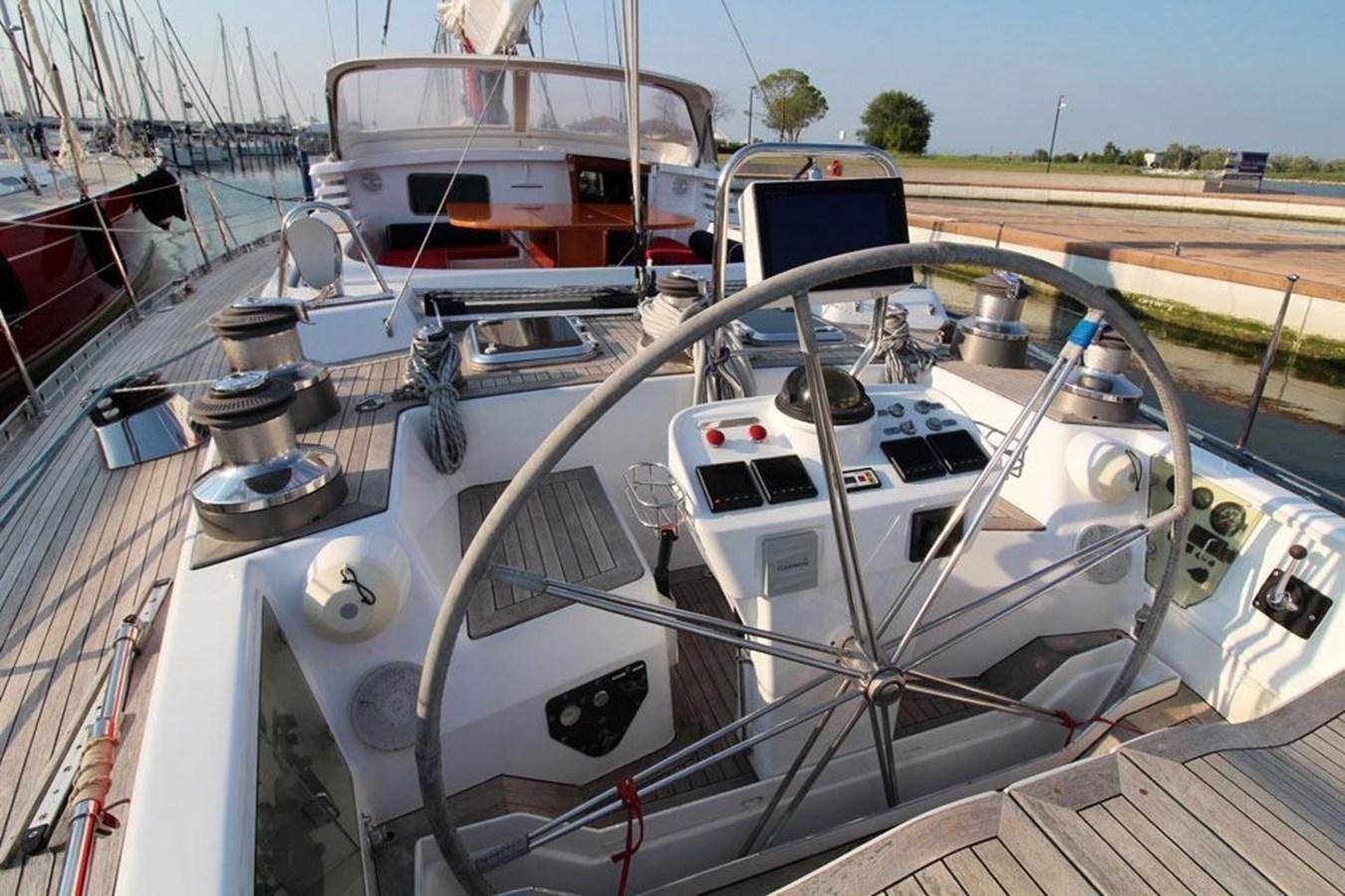 a boat is parked in a harbor aboard PLUM Yacht for Sale