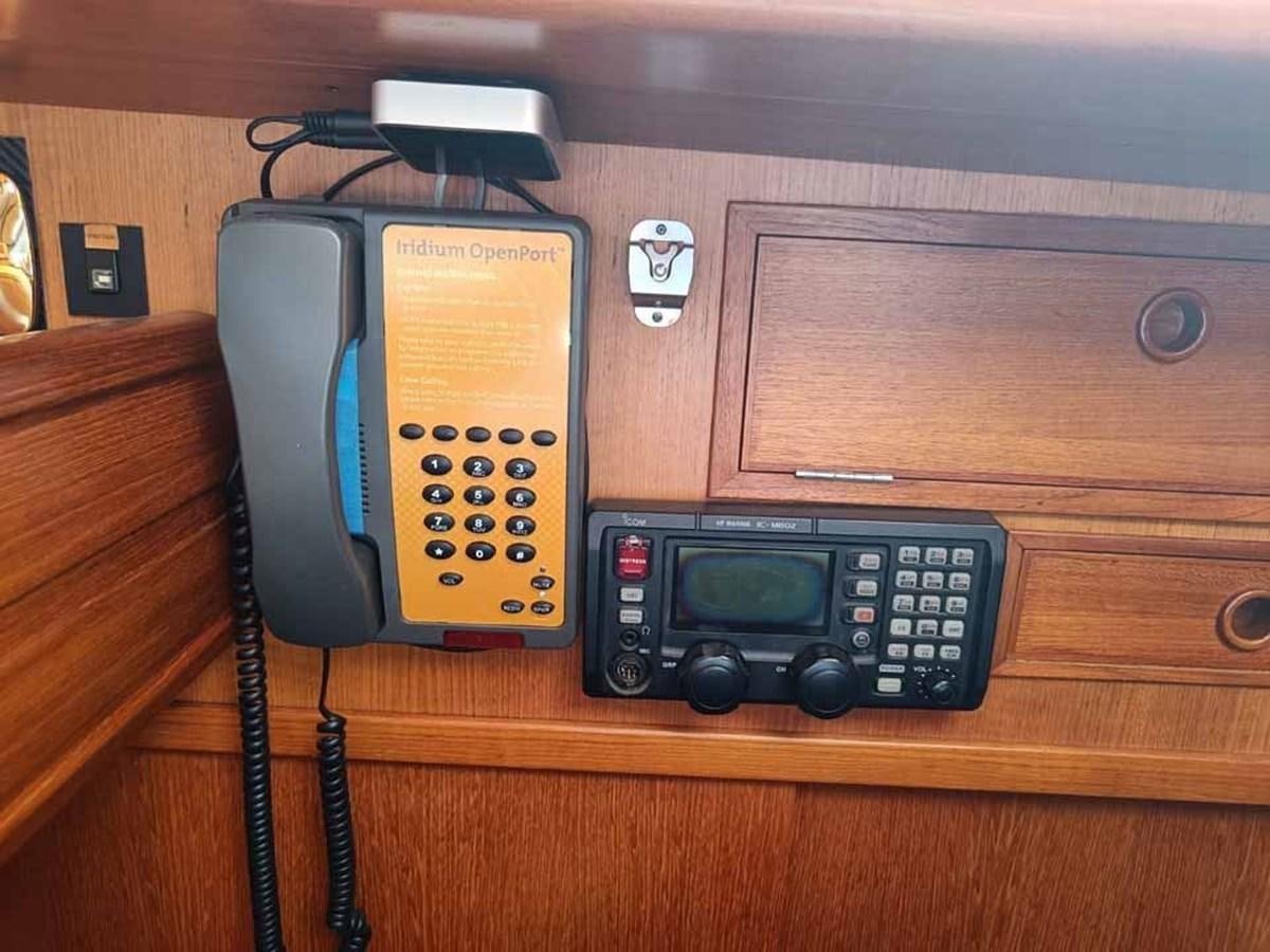 a telephone on a wooden shelf aboard PLUM Yacht for Sale