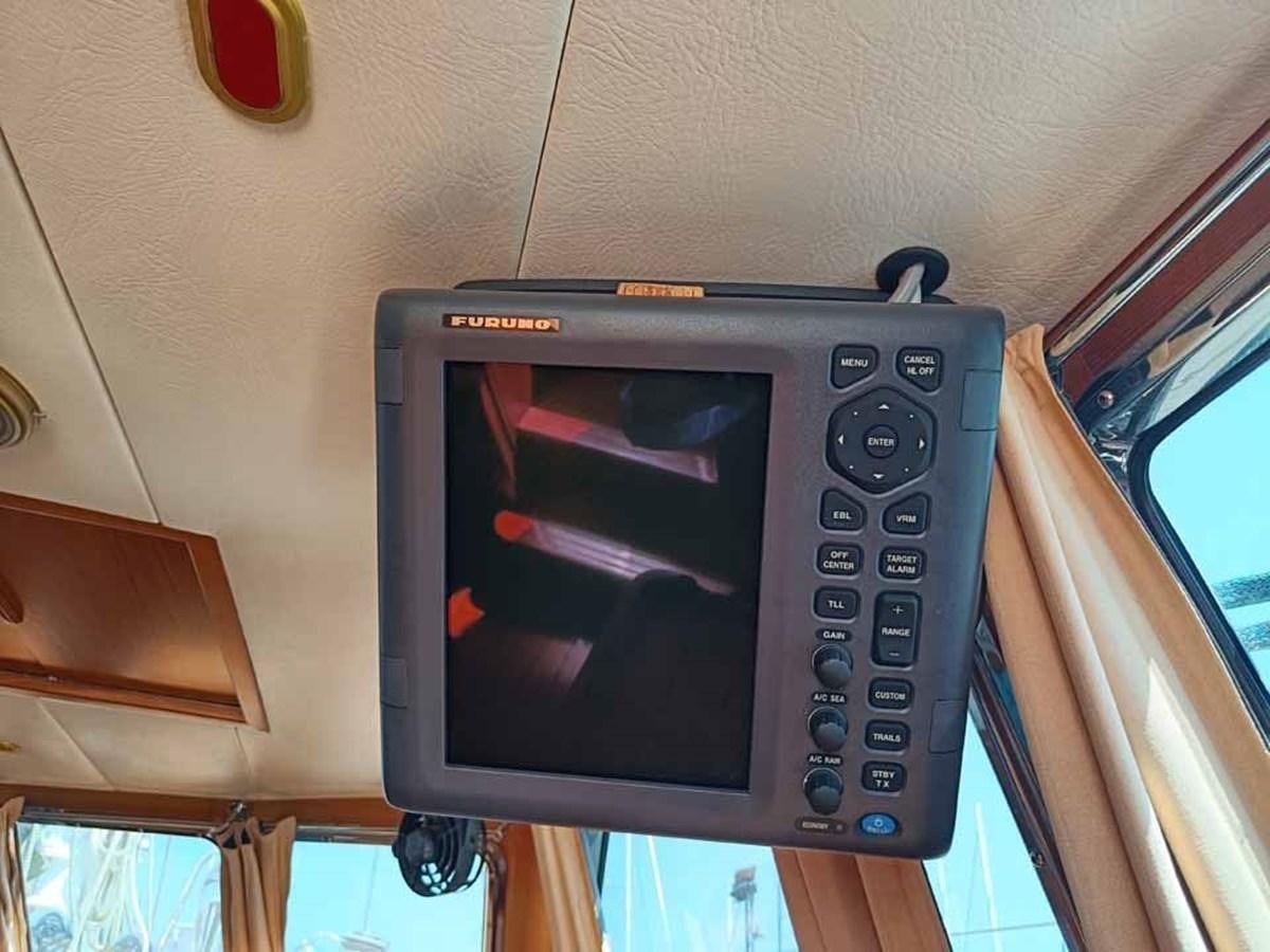 a microwave oven on a shelf aboard PLUM Yacht for Sale