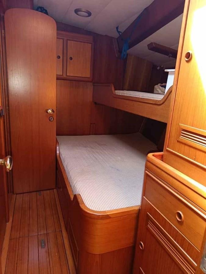 a bathroom with a wood cabinet aboard PLUM Yacht for Sale