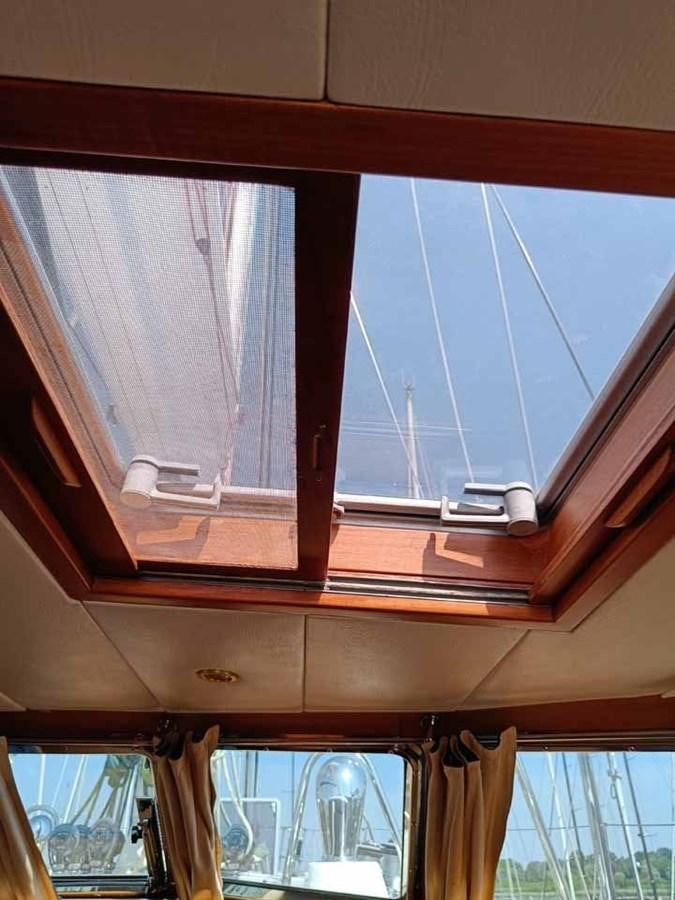 a window with blinds aboard PLUM Yacht for Sale
