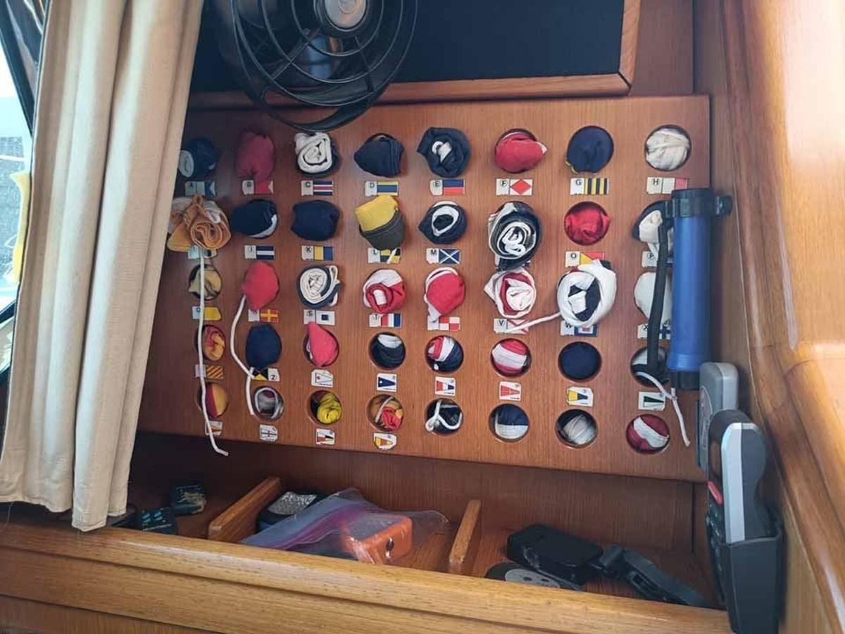 a wooden board with buttons and knobs aboard PLUM Yacht for Sale