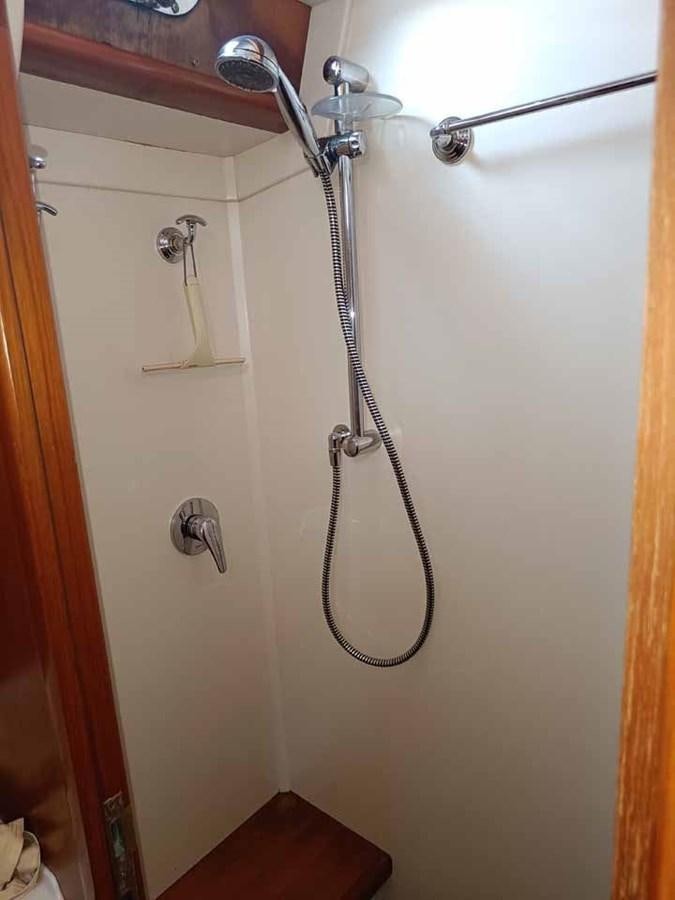 a shower with a metal handle aboard PLUM Yacht for Sale