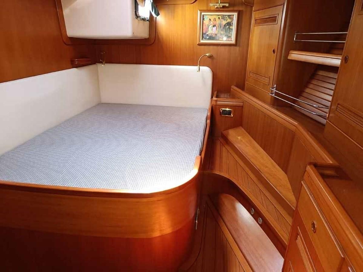 a bed in a room aboard PLUM Yacht for Sale