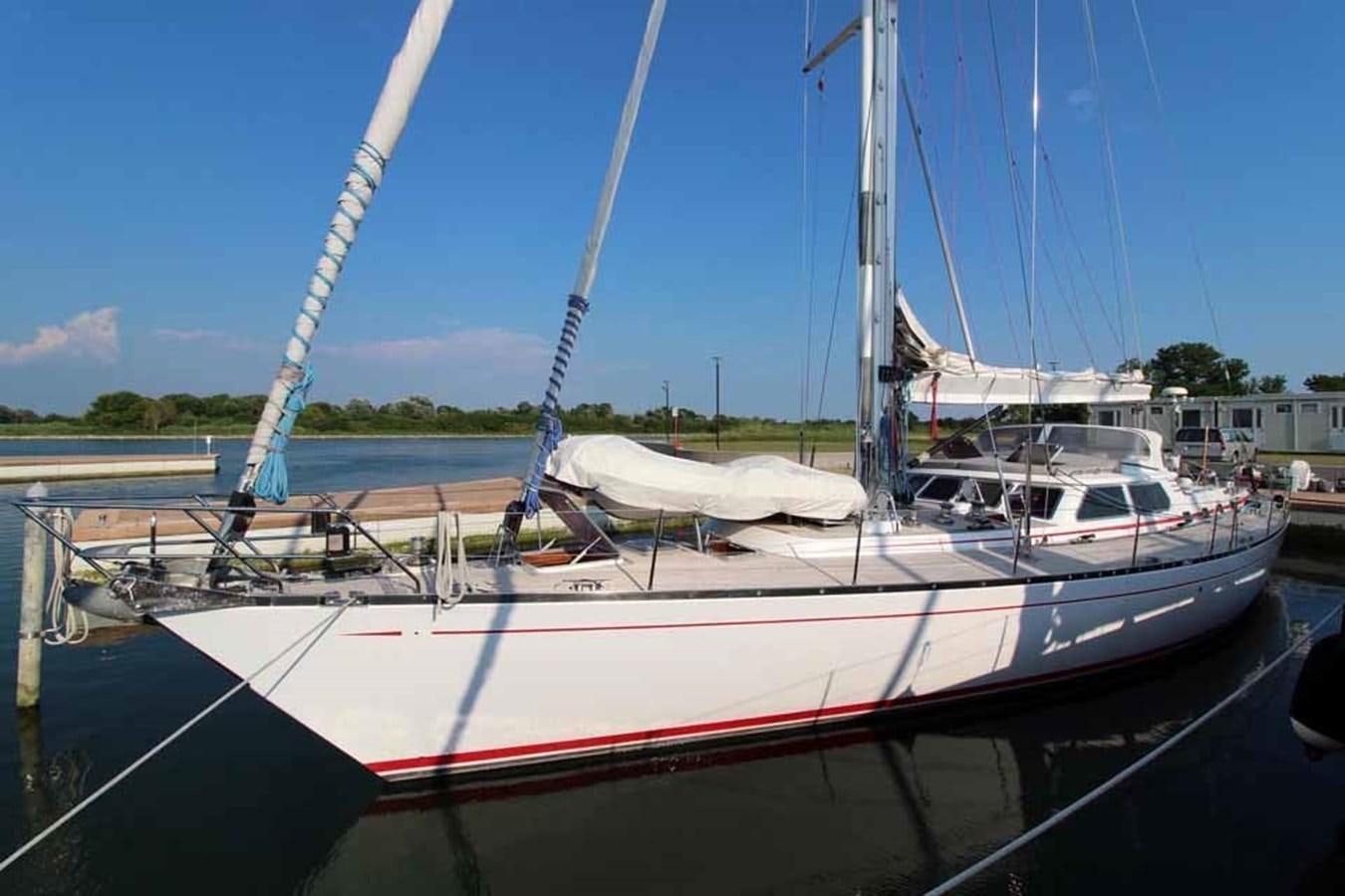 a boat docked at a pier aboard PLUM Yacht for Sale