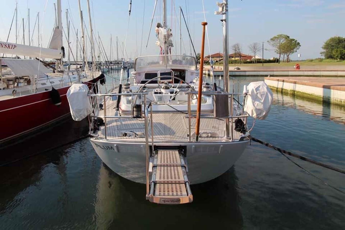 a boat tied to a dock aboard PLUM Yacht for Sale