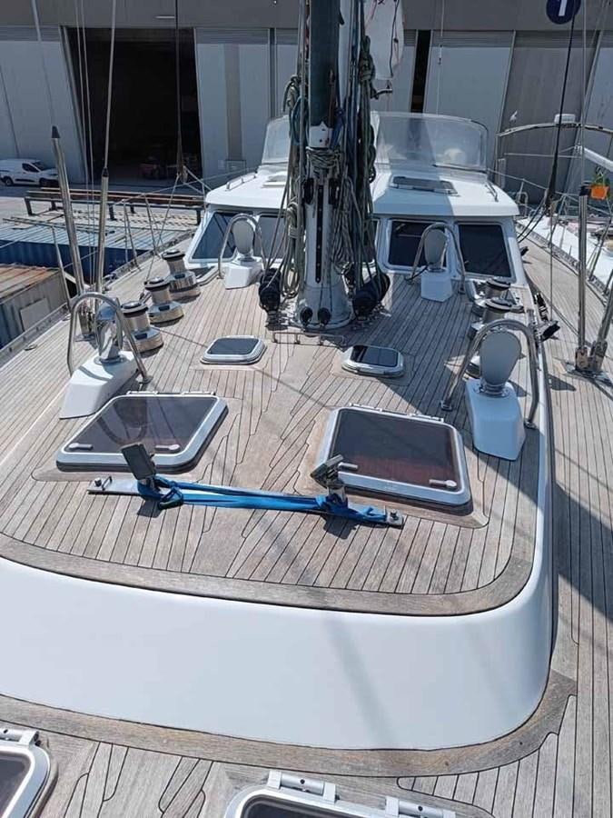a table with laptops and a laptop on it aboard PLUM Yacht for Sale