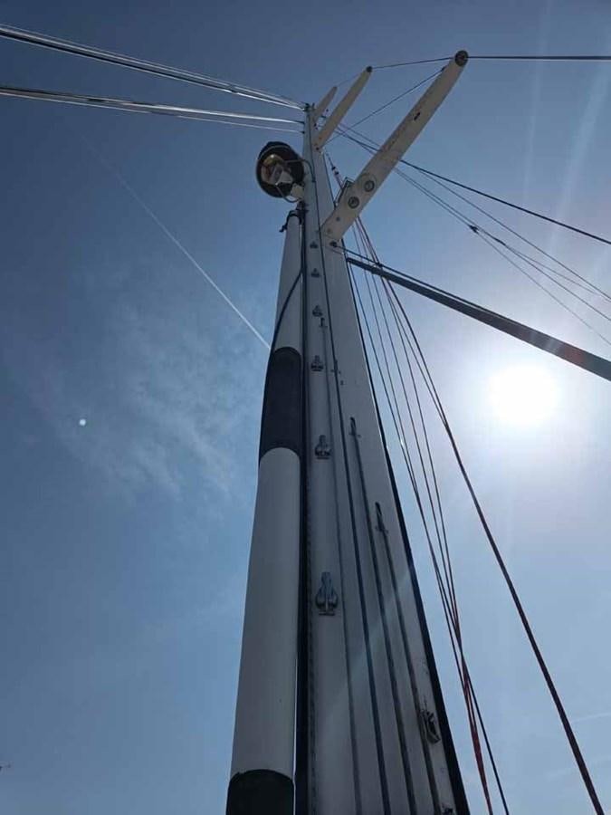 a sailboat with a large sail aboard PLUM Yacht for Sale