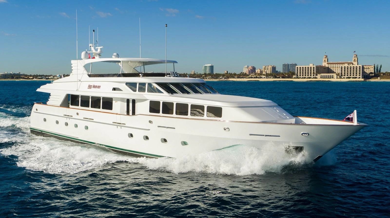 a white yacht on the water aboard HOG HEAVEN Yacht for Sale