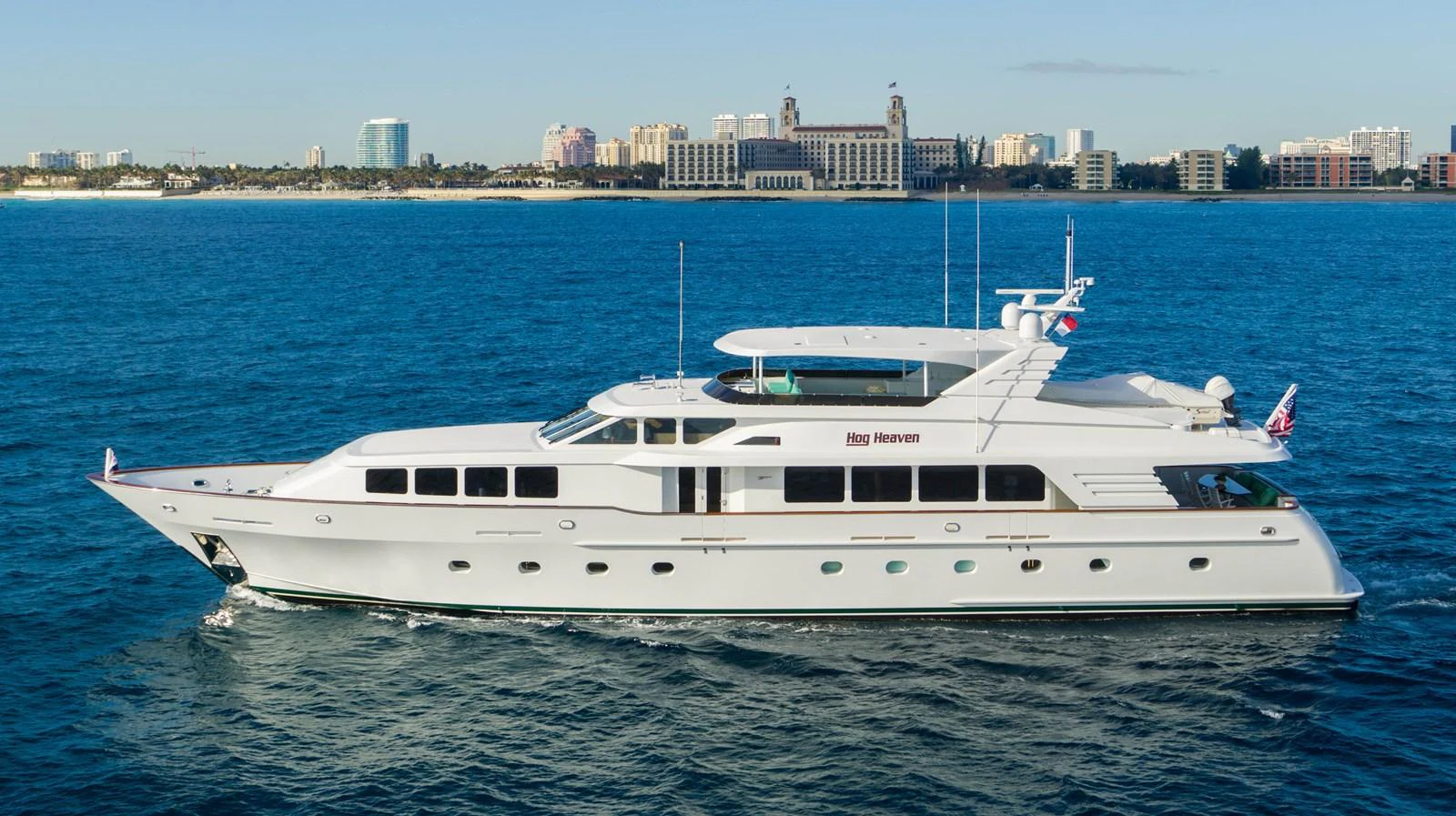 a white yacht in the water aboard HOG HEAVEN Yacht for Sale