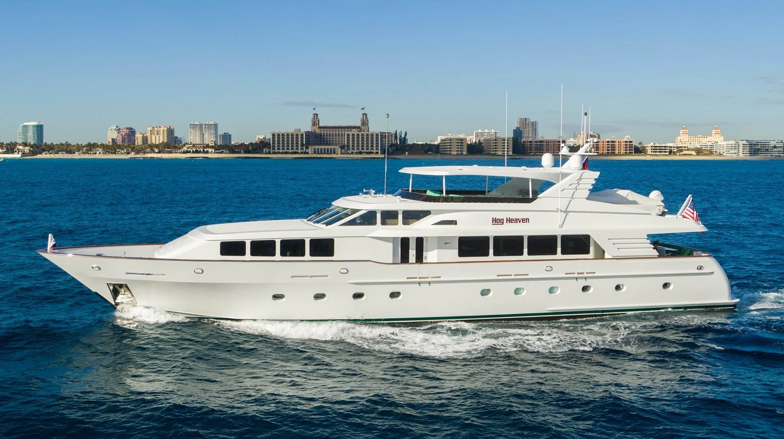 a white yacht in the water aboard HOG HEAVEN Yacht for Sale