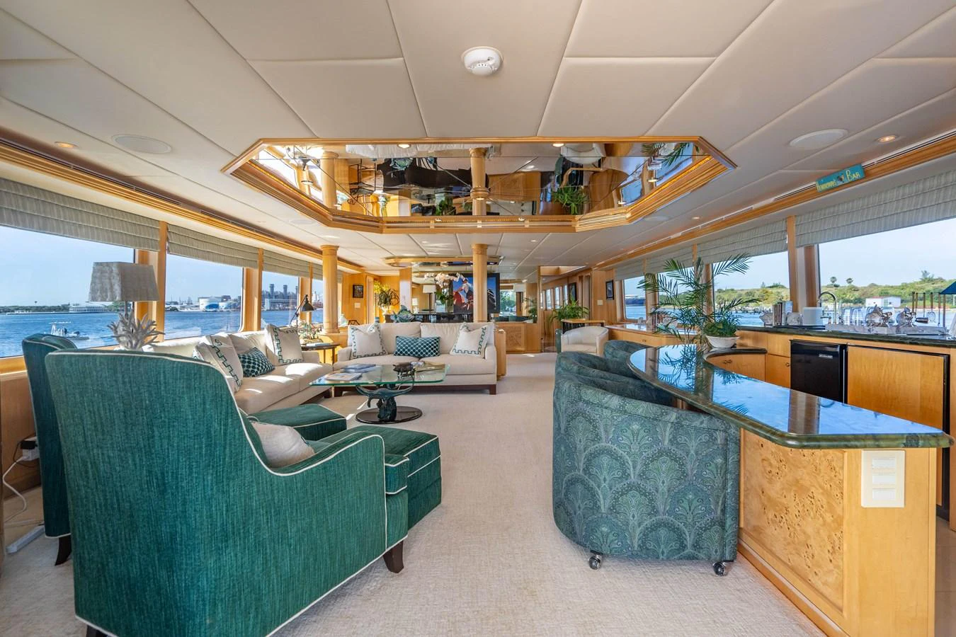 a room with a couch and a table aboard HOG HEAVEN Yacht for Sale