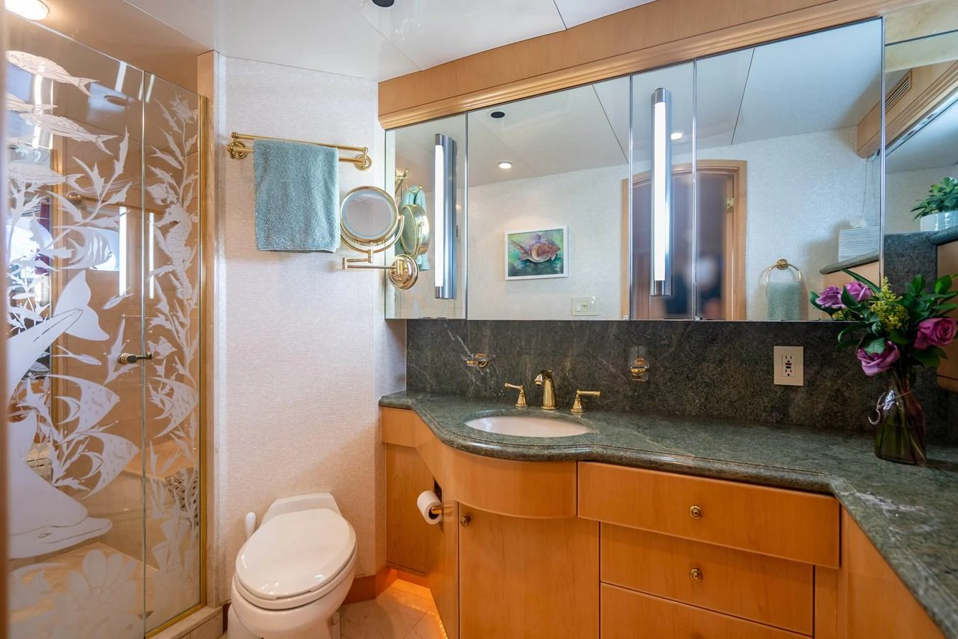 a bathroom with a large mirror aboard HOG HEAVEN Yacht for Sale