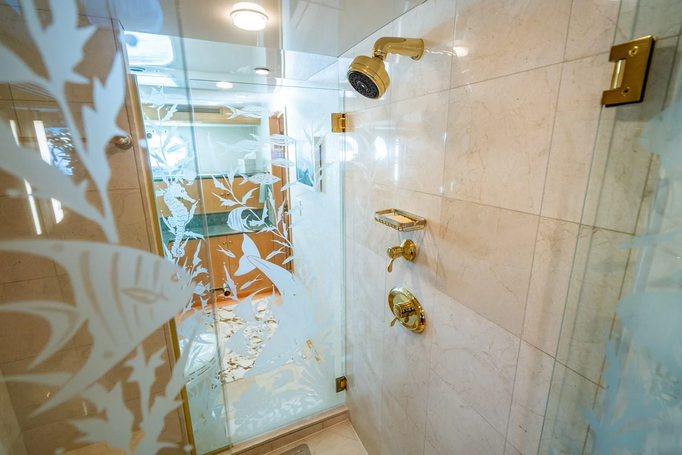 a bathroom with a glass shower aboard HOG HEAVEN Yacht for Sale