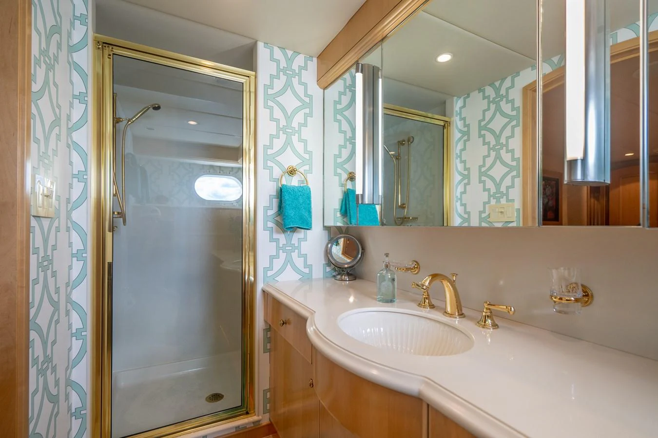 a bathroom with a large mirror aboard HOG HEAVEN Yacht for Sale