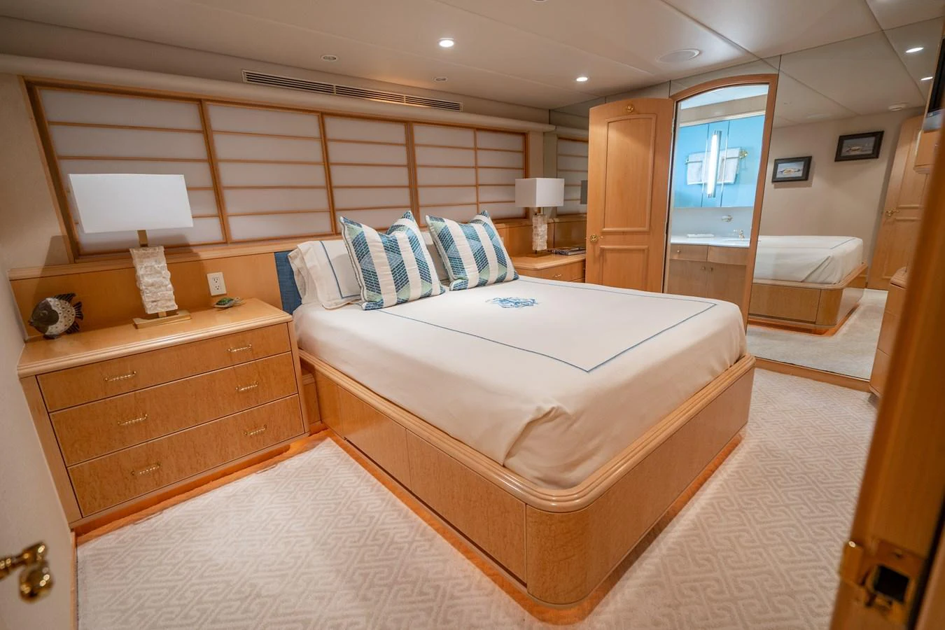 a room with a bed and a desk aboard HOG HEAVEN Yacht for Sale