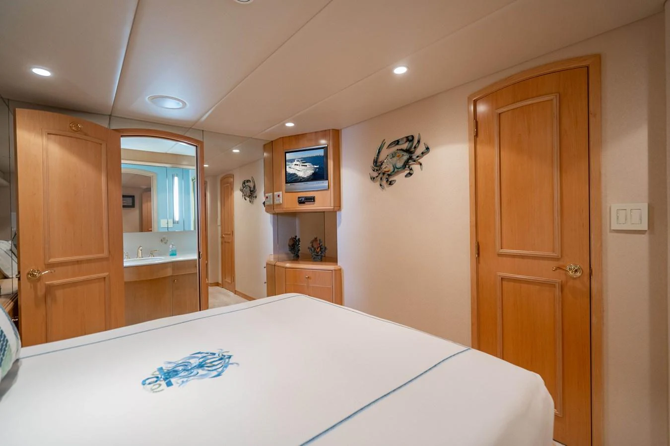 a bedroom with a bed aboard HOG HEAVEN Yacht for Sale